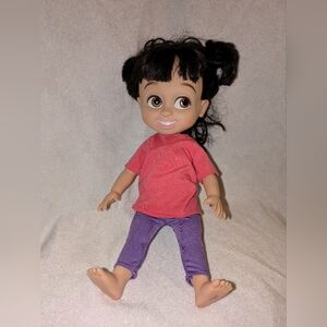 Adorable Doll with Pink Shirt and Purple Pants